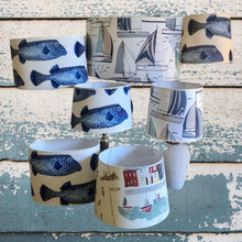 Charger l'image dans la galerie, Abat-jours ovales et tambour, tissu lin à motifs de poissons coffre, contrecollé.